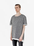 Side angle view of Granite Raw Cut Pullover Sweatshirt Tee in Tri-Blend Gray on model