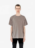 Front view of Pigment Dyed Basic Tee in Sandstone on model