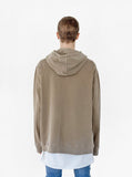 Back view of model wearing Pigment Dyed Washed Hoodie in Faded Khaki