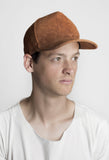 Side angle view of Textured Suede Snapback Hat in Camel Brown on model